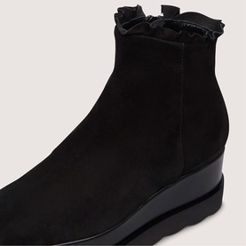 Marco Moreo black suede ankle boot with ruffle trim collar and wedge sole, close-up detail shot