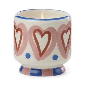 Paddywax A Dopo Hearts Ceramic Candle in Rosewood Vanilla, cream vessel with pink hearts and blue dot detail, lit cotton wick