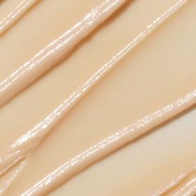 Fenty Skin Lip Care texture swatch showing glossy, pearlescent pale nude formula with a smooth, hydrating consistency