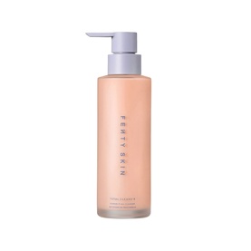 Fenty Skin cleanser in a peach pump bottle with grey pump top, vertical brand lettering on front