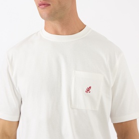 Model wearing Gramicci One Point Chest Pocket T-Shirt in white, with red embroidered logo on chest pocket, crew neck, short sleeves.