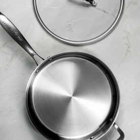 Prochef 28cm Tri-Ply Stainless Steel Saut&eacute; Pan with glass lid, shown from above on marble surface