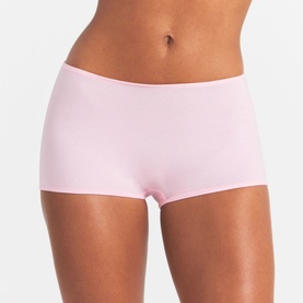 Model wearing light pink seamless boyshort briefs with smooth finish and mid-rise waistband