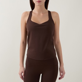 Model wearing dark brown ribbed racerback vest top with sweetheart neckline, styled with matching brown leggings