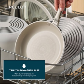 Circulon Halo with LaserDefense&trade; Non Stick Ceramic Frying Pan 25cm in white, shown dishwasher safe inside a loaded dishwasher rack.