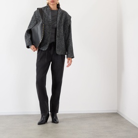 Model wearing Isabel Marant Etoile sand wool blazer, styled with dark knit, black tailored trousers and black ankle boots