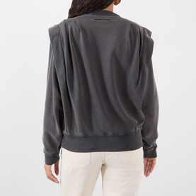 Model wearing Isabel Marant Etoile Soldy Structured Sweatshirt in faded black with dropped structured shoulders, ribbed trims, styled with white