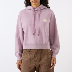 Model wearing Isabel Marant Etoile rosewood cropped hoodie with ecru logo patch, styled with tan wide-leg trousers.