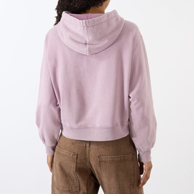 Model wearing Isabel Marant Etoile rosewood cropped hoodie sweat, back view, styled with brown wide-leg trousers