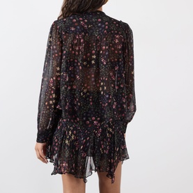 Model wearing Isabel Marant Etoile Florine Abstract Print Blouse in black, featuring floral print chiffon, ruffled hem, long sleeves with buttoned