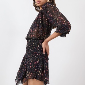 Model wearing Isabel Marant Etoile Florine Abstract Print Blouse in black, styled with a matching floral mini skirt