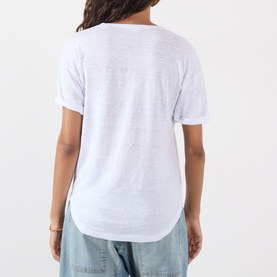 Model wearing Isabel Marant Etoile Koldia Logo T-Shirt in White/Pink, back view showing curved hem, short sleeves and slub linen fabric
