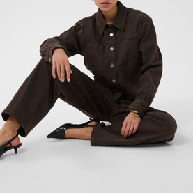 Model wearing Kaffe Coffee Bean denim jacket and matching wide-leg trousers, styled with black kitten heel mules and a gold cuff bracelet.