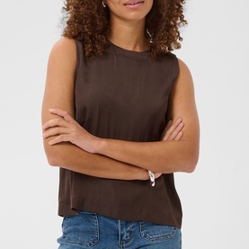 Model wearing Kaffe sleeveless top in Coffee Bean, relaxed fit with crew neck, arms crossed at waist