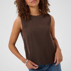Model wearing Kaffe Coffee Bean sleeveless top with crew neck, styled with blue jeans and a silver bracelet.