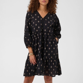 Model wearing Kaffe black grey vintage baroque print tiered mini dress with V-neck and long sleeves, styled with gold bracelet