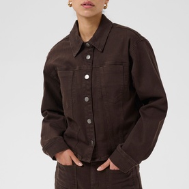 Model wearing Kaffe Coffee Bean denim jacket with silver button fastening, styled with matching trousers