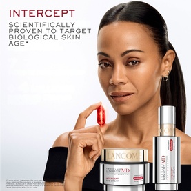 Model with Lanc&ocirc;me Intercept skincare set; holding a capsule, with cream jar and two serums styled in foreground