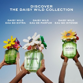 Marc Jacobs Daisy Wild Collection: three fragrances held aloft &mdash; Eau So Extra, Eau de Parfum, and Eau So Intense in green bottles with floral tops