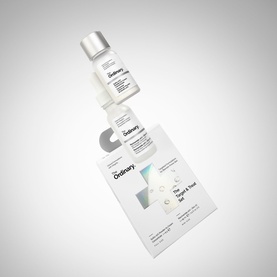 The Ordinary The Target & Treat Set skincare gift set with toner bottle and informational leaflet, floating arrangement on white background