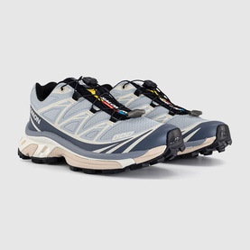 Salomon XT-6 trainers in Pearl Blue Grisaille, chunky off-white midsole, black rugged outsole, toggle lace fastening.