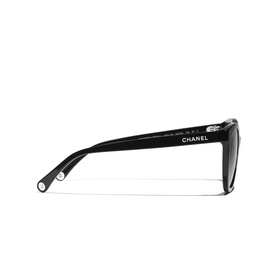 Chanel sunglasses in black with silver-tone hardware, cat-eye silhouette, shown from the side angle