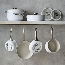 Circulon Halo with LaserDefense&trade; 6 Piece Non Stick Ceramic Cookware Set in white, displayed on shelf and hanging rack, showing pans, saucepans and