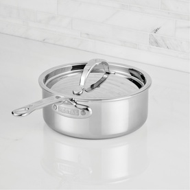 Hestan ProBond Luxe Covered Saucepan 18cm in polished stainless steel with glass lid and seamless handle, on marble surface.