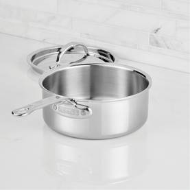 Hestan ProBond Luxe Covered Saucepan 18cm/1.9L in polished stainless steel with seamless handle and matching lid, shown on marble surface.