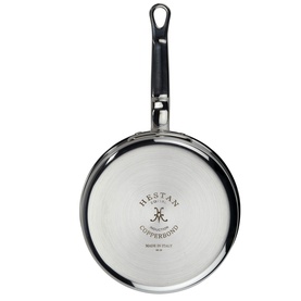 Hestan Copperbond 18cm Saucepan, stainless steel exterior with black handle, base view showing brand crest, handcrafted in Italy.
