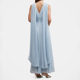 Model wearing pale blue sleeveless pleated maxi dress with flowing cape overlay and V-back neckline, rear view