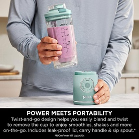 Ninja Blast Max Cordless Portable Blender in Seaglass, shown twist-and-go detachable cup being lifted from base unit