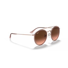 Ray-Ban round double bridge sunglasses in rose gold metal frame with pink gradient lenses, angled view