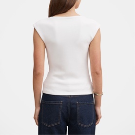 Model wearing white sleeveless fitted top with structured shoulders, styled with dark indigo jeans and a gold bracelet, rear view