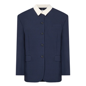 Navy blue single-breasted blazer with contrast cream collar, dark buttons, and front flap pockets