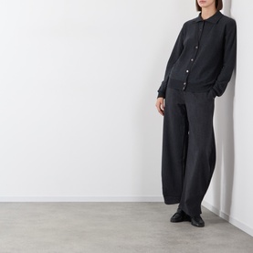 Model wearing Source Unknown Fabbie Layered Cardigan in charcoal, styled with wide-leg trousers and black loafers