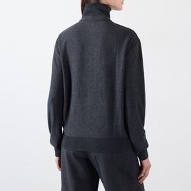 Model wearing Source Unknown Fabbie Layered Cardigan in charcoal. Turtleneck, dropped shoulders, ribbed trims. Styled with matching trousers.