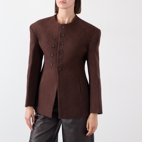 Model wearing Source Unknown Banton Double-Breasted Jacket in brown, collarless with structured shoulders and hourglass silhouette, styled with black