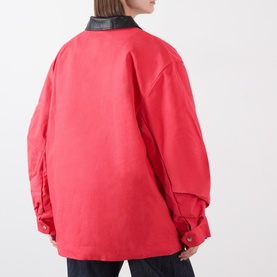 Model wearing Source Unknown Baia Fleece Field Jacket in red, rear view, showing contrasting dark collar, dropped shoulders and snap button cuffs.