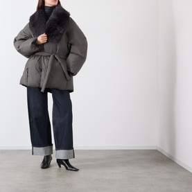 Model wearing Source Unknown Egizio Faux Fur Trim Wrap Jacket in charcoal with detachable faux fur collar and belt, styled with wide-leg jeans and