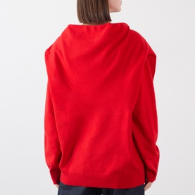 Model wearing Source Unknown Tio Shawl Sweater in red, showing draped shawl back detail, dropped shoulders and long sleeves