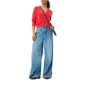 Model wearing Whistles red long-sleeve V-neck top with wide-leg blue jeans and brown crossbody bag.