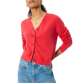 Model wearing Whistles red button-front V-neck cardigan, styled with light blue jeans and a delicate gold necklace.