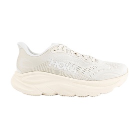 Hoka trainer in Alabaster Oat Milk, mesh upper with logo branding, thick cushioned white sole, lateral side view