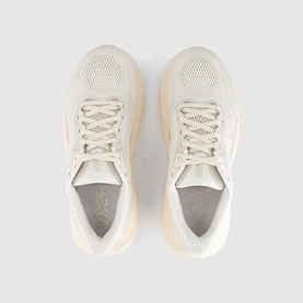 Hoka trainer in Alabaster Oat Milk, overhead view showing mesh upper, lace-up fastening, and chunky cream sole