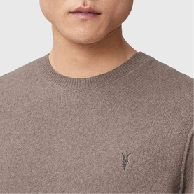 Model wearing a taupe marl crew neck knit jumper with AllSaints logo embroidery at chest, close-up detail view