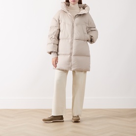 Model wearing Marella turtledove puffer coat with hood, styled with cream wide-leg trousers and taupe loafers.