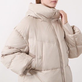 Model wearing Marella turtledove puffer coat with high collar, zip fastening, and oversized quilted silhouette