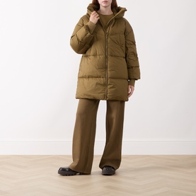 Model wearing Marella Oil Green quilted hooded puffer coat, styled with wide-leg trousers and black loafers.