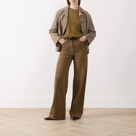 Model wearing Marella Oil Green wool-cashmere knit top, styled with beige blazer, wide-leg trousers and black belt.